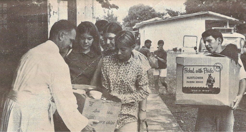 GIFTS: Father Angel M de Moreta receives food and clothes, from the “Angels,” a group of high school students from Subic Bay.