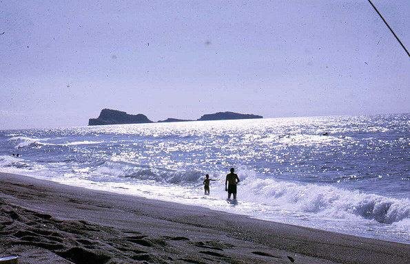 The San Miguel beach with the Capones in the background. (Photo by Aron Cook, who was stationed at San Miguel 1967-8.)